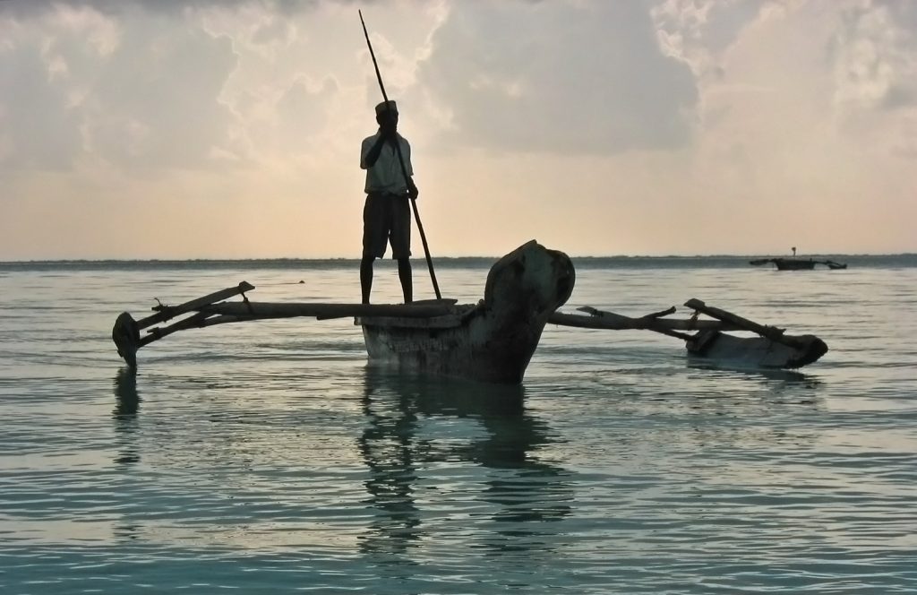 Jambiani, Zanzibar- fisherman on a dhow in the early morning
