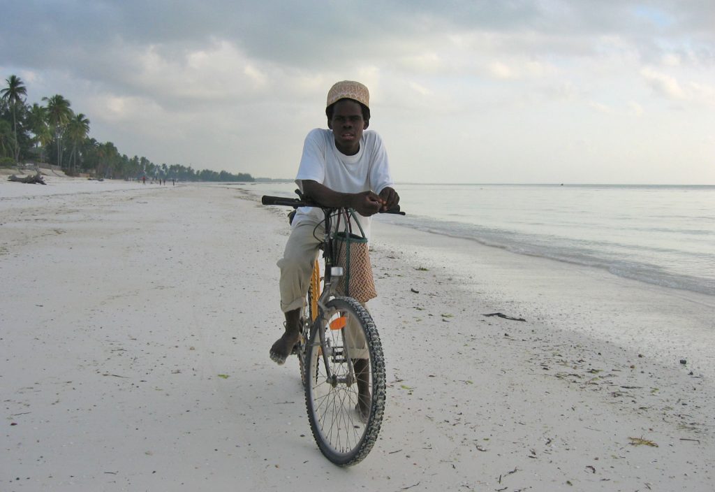 Jambiani – A boy on his bike, up before sunset to buy fish from the local fishermen