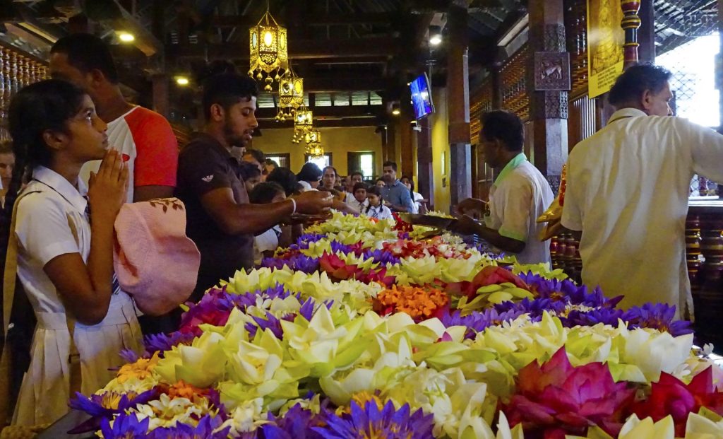 Kandy - Temple of  the Sacred Tooth Relic - Worshippers with Flowers