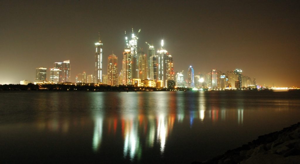 Dubai by night - reflection of skyscrapers in the water