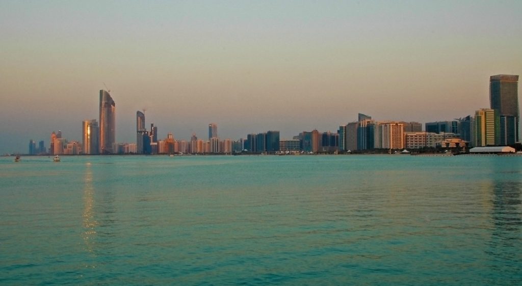 Evening in Abu Dhabi. The Corniche seen from across