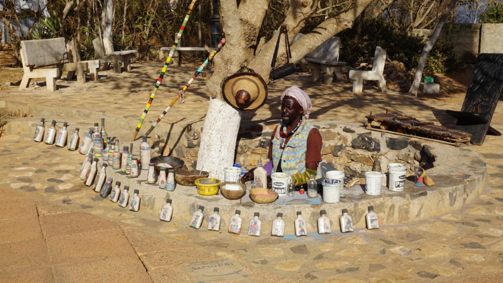 The Bottle Artist of Ile de Gorée. This gentleman specializes in sand images inside bottles. He has a wide variety readily available, and is happy to make a customized on demand
